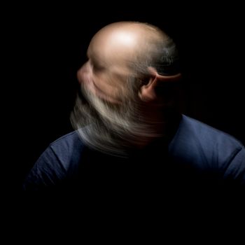 An image of a bearded man motion blur portrait