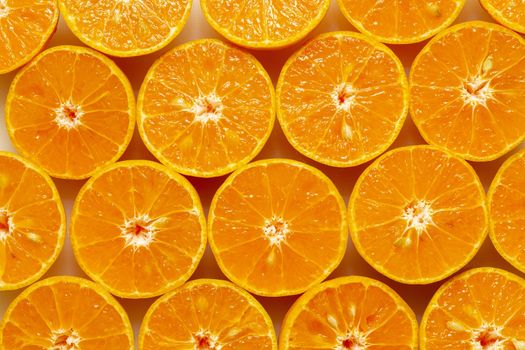 Fresh oranges cut in half before squeezing to juice