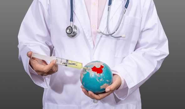 doctor in medical gown using an antiviral vaccine syringe on the red China map on the globe in hand. outbreak situation of Coronavirus 2019 infection or Covid-19