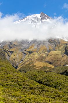 An image of the volcano Taranaki covered in clouds, New Zealand