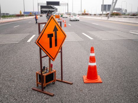 The signs repairs road and worker on the road