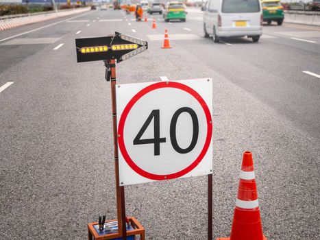 The signs repairs road and worker on the road