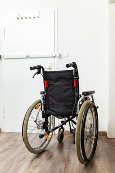 An image of a wheelchair at an apartment door