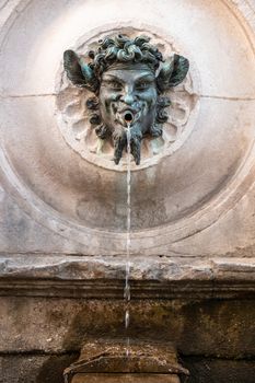An image of a bacchus fountain in Marche Italy