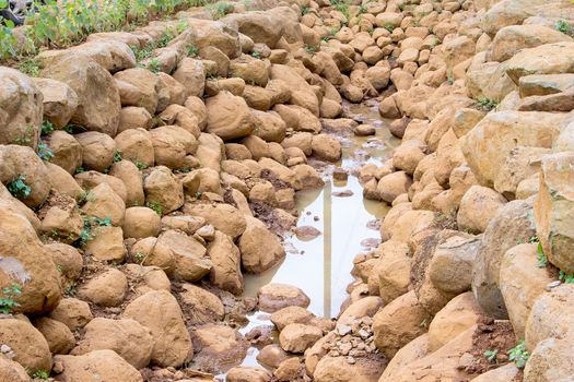 Brown stone wall on the ground, the water shortage