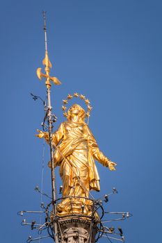 An image of the beautiful golden Madonna statue at Cathedral Milan Italy