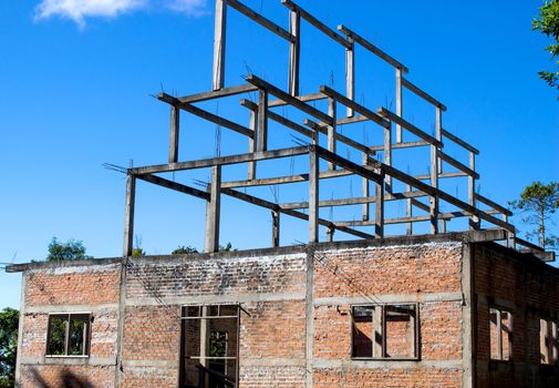 Unfinished homes built with old structures.