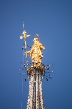 An image of the beautiful golden Madonna statue at Cathedral Milan Italy