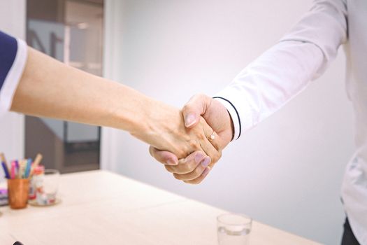 Business people shake hands to finish the meeting , Hand in hand to work together