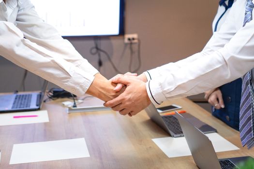 Business people shake hands to finish the meeting , Hand in hand to work together