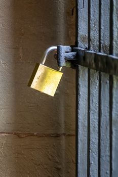 An image of a padlock on iron gate