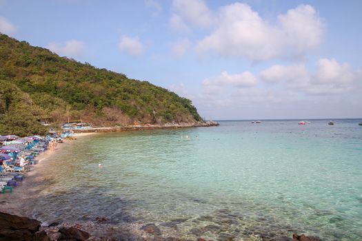 Koh Lan,thailand-February 9,2014:tourist visit and play water on the beach at koh lan ,because the beach most beautiful.