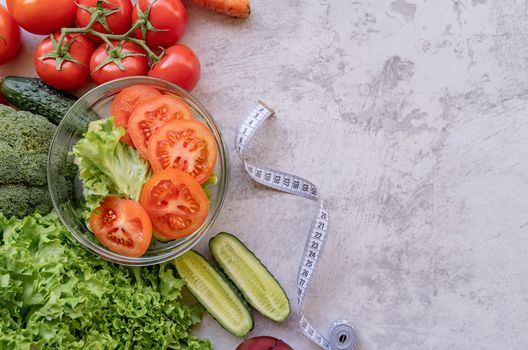 Healthy diet. Fresh vegetables and salad for healthy diet with copy space flat lay on dark background