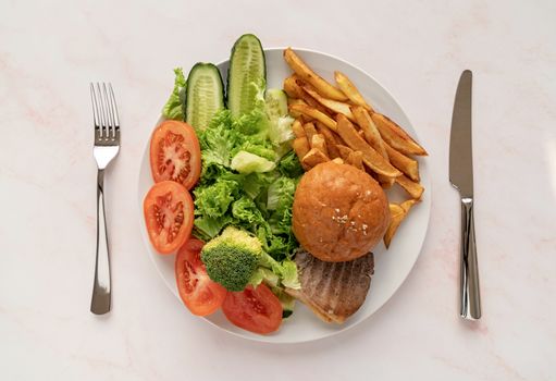 Healthy and unhealthy food concept. Fast food and healthy diet on one plate