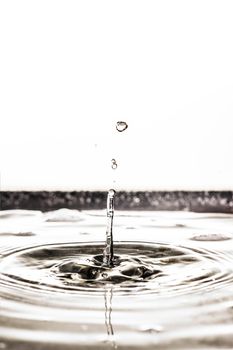 An image of a beautiful black water drop background tilt