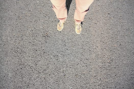 An image of a man standing on the street background