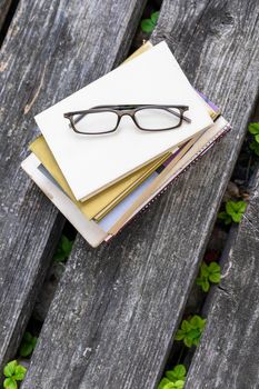 An image of some books and reading glasses background