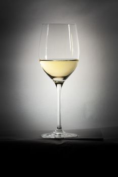 A vintage white wine glass details with text space