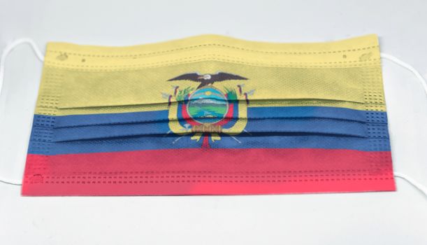 surgical mask with the national flag of Ecuador printed. Pandemic covid-19 and preventive measures to counter the spread of the virus