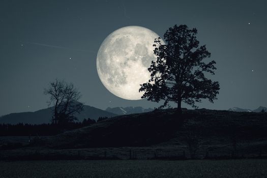 An image of a beautiful moon and stars background