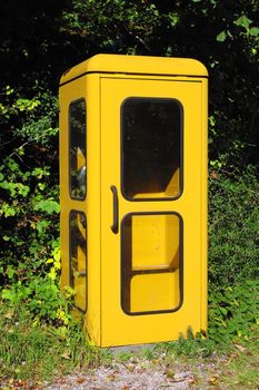 An image of a vintage yellow german phone box