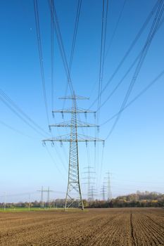 A photography of a power pole on a field