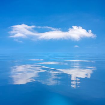 An image of the blue sky with white cloud over the sea