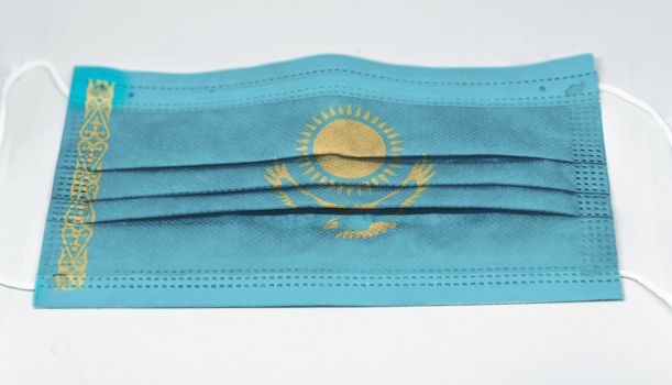 surgical mask with the national flag of Kazakhstan printed. Pandemic covid-19 and preventive measures to counter the spread of the virus