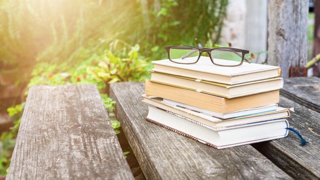 An image of some books and reading glasses background