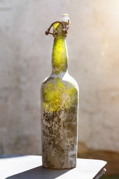 An image of a dirty old wine bottle