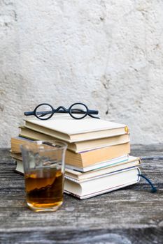 An image of some books and reading glasses background