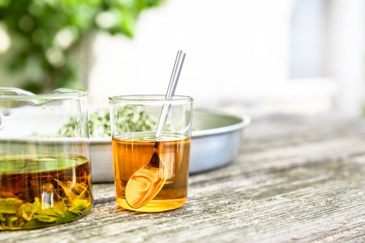 A verbena tea on old wooden planks