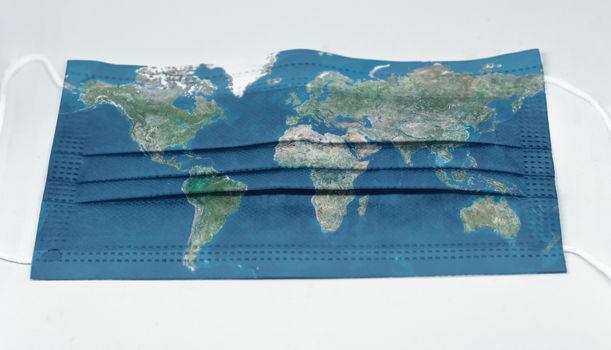 surgical mask with the map of the world printed. Pandemic covid-19 and preventive measures to counter the spread of the virus