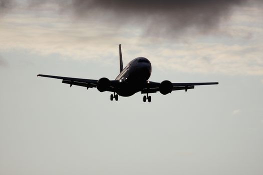 An image of a plane in the sky background