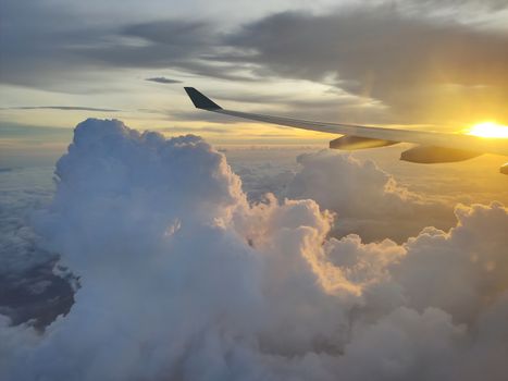 An image of a beautiful sunset over the clouds