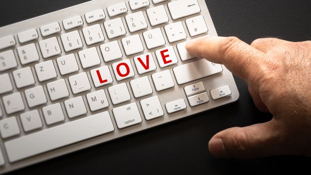 Sending a romantic mail on a keyboard with love letters