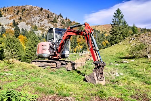 An image of a digger in the mountains