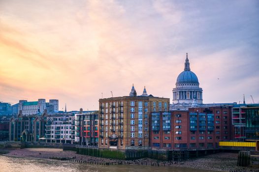 St. Paul's Cathedral across Millennium Bridge and the River Thames in London, UK.