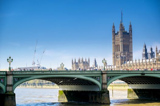 British Parliament along the River Thames on a sunny day in London, UK.