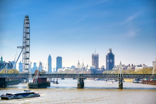 A view along the River Thames on a sunny day in London, UK.