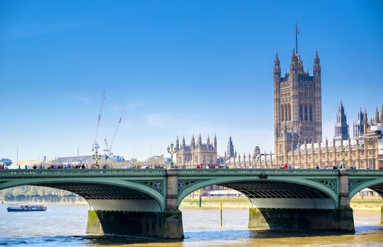 British Parliament along the River Thames on a sunny day in London, UK.