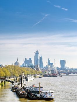 A view along the River Thames on a sunny day in London, UK.