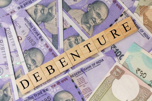 Debenture Business and Financial as concept on Indian currency notes
