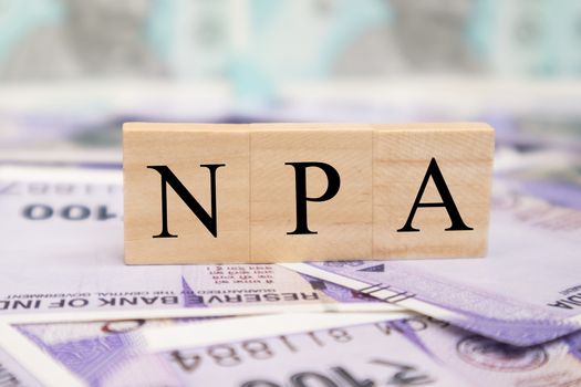 NPA or Non Performing Assets business concept on indian currency notes