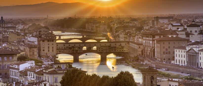 Panorama of famous bridge Ponte Vecchio at sunset in Florence, Tuscany, Italy