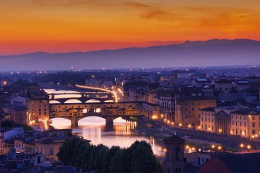 Panorama of famous bridge Ponte Vecchio at sunset in Florence, Tuscany, Italy