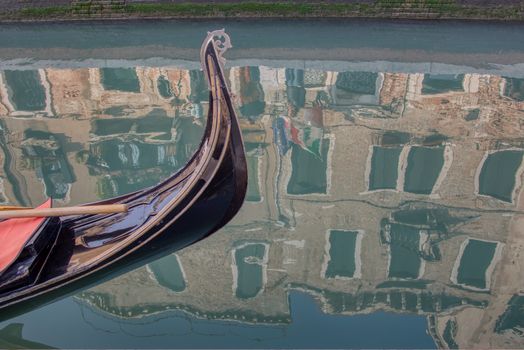 Venice gondola and reflection of buildings in water,Venice,Italy