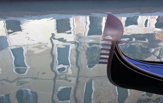 Venice gondola and reflection of buildings in water,Venice,Italy