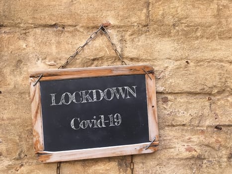 Blackboard with coronavirus lockdown text. Coronavirus (Covid-19) outbreak, business closed