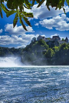 the famous rhine falls in the swiss near the city of Schaffhausen - sunny day and blue sky